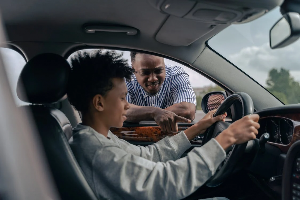 kid learning to drive