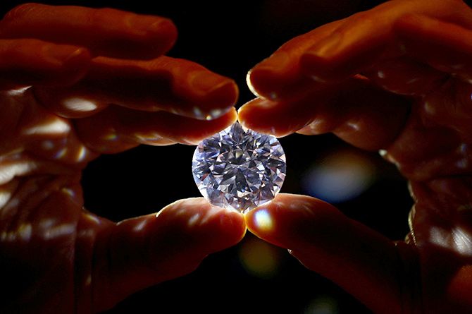 woman hold Diamond in her hand - Diamond Industry