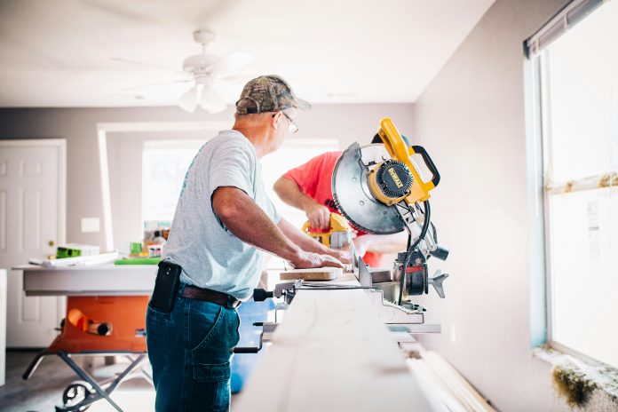 men working on the interior of a house