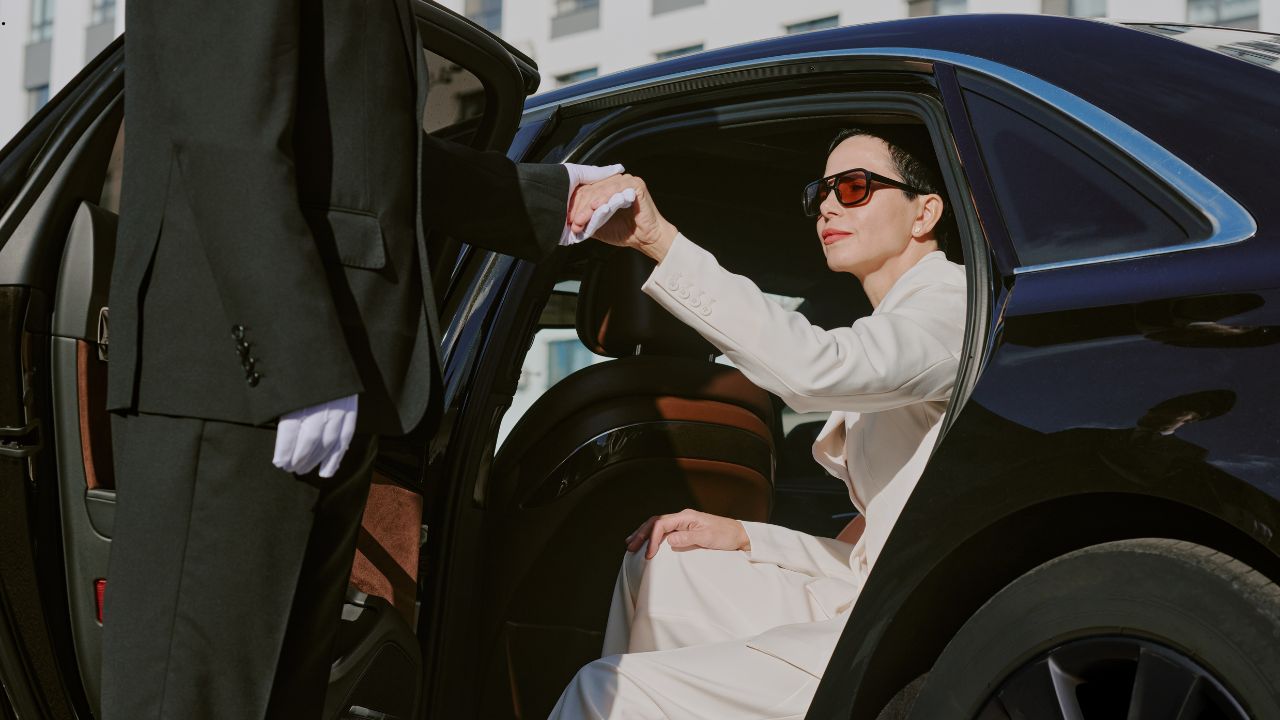 woman getting out of car